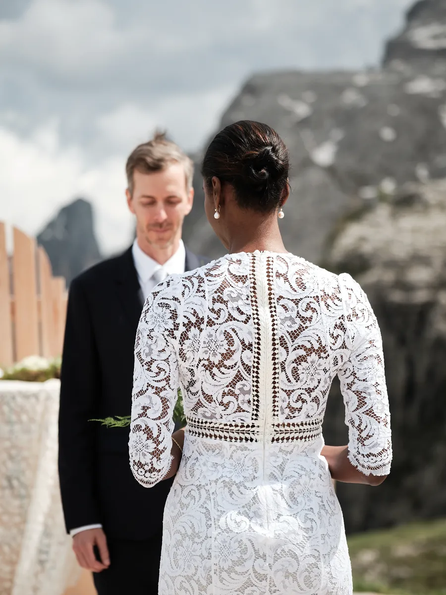 Bride and groom looking at each other in the Dolomites