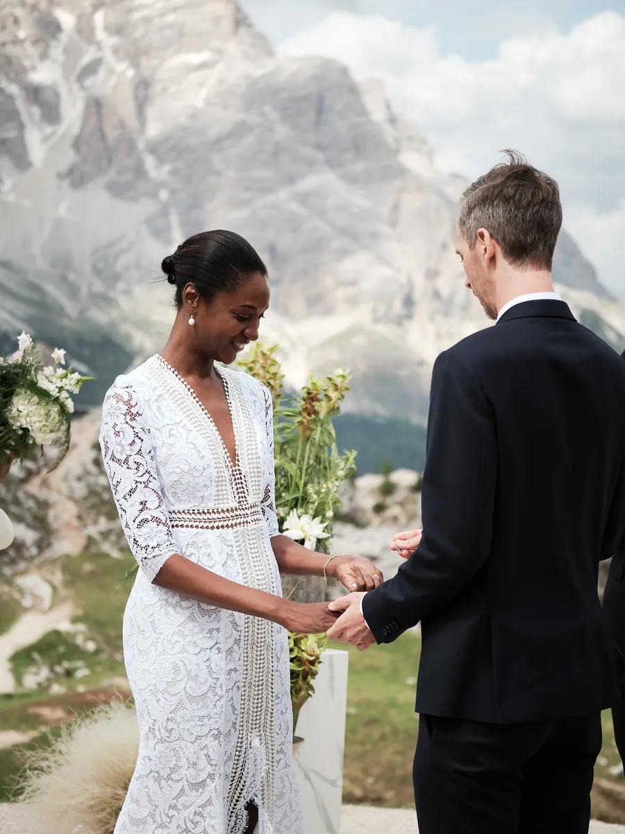 Bride and groom alone in front of the Dolomites