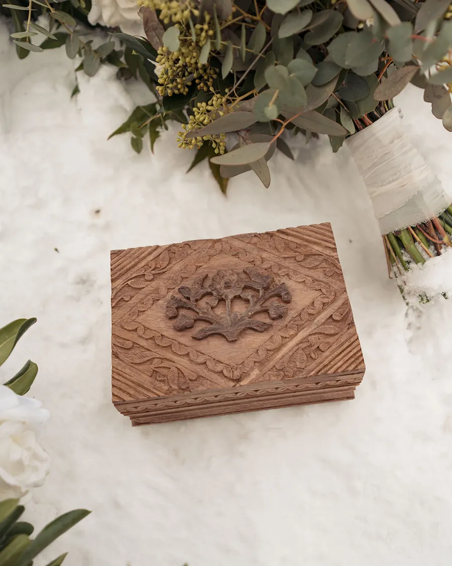 Vow book and details for a winter elopement