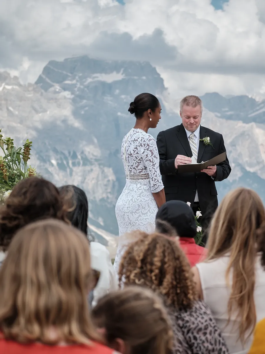 Outdoor wedding ceremony in front of the Dolomites