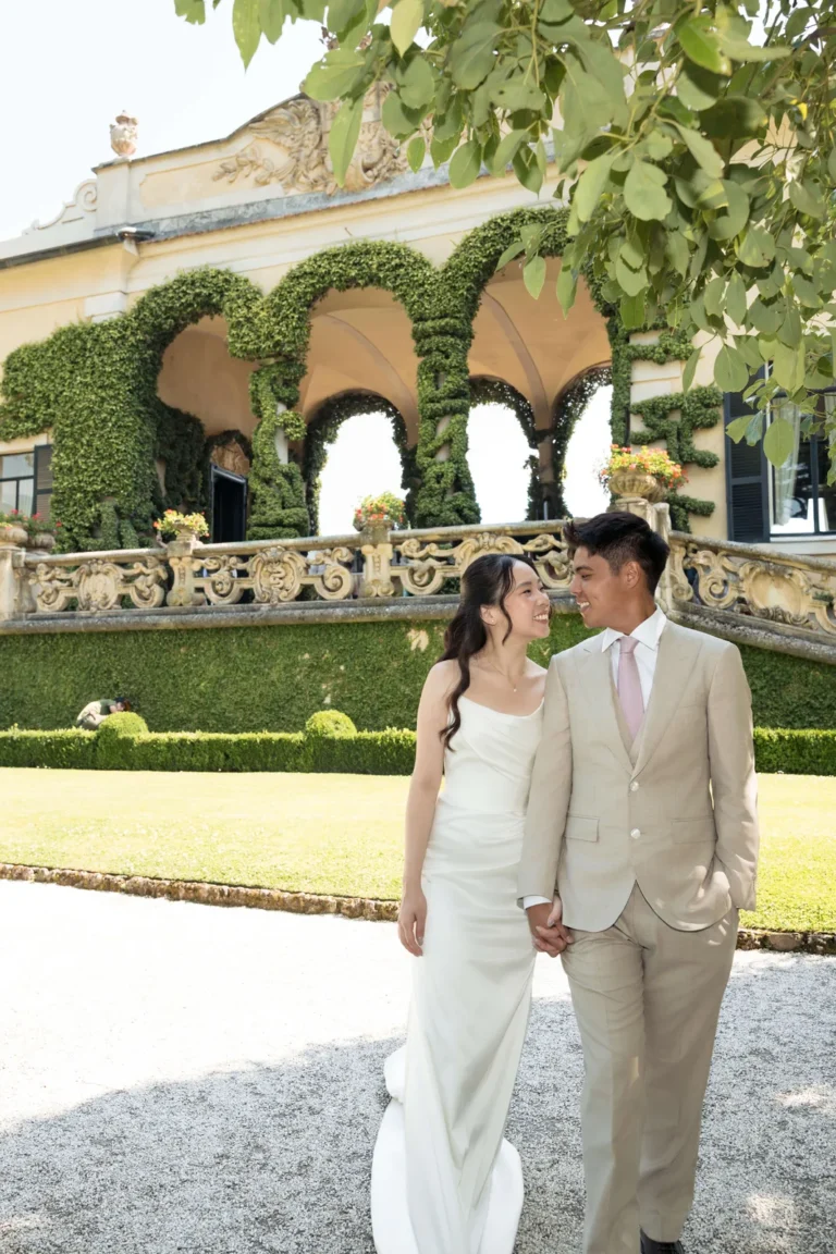 Couple strolling through the gardens of a Lake Como villa