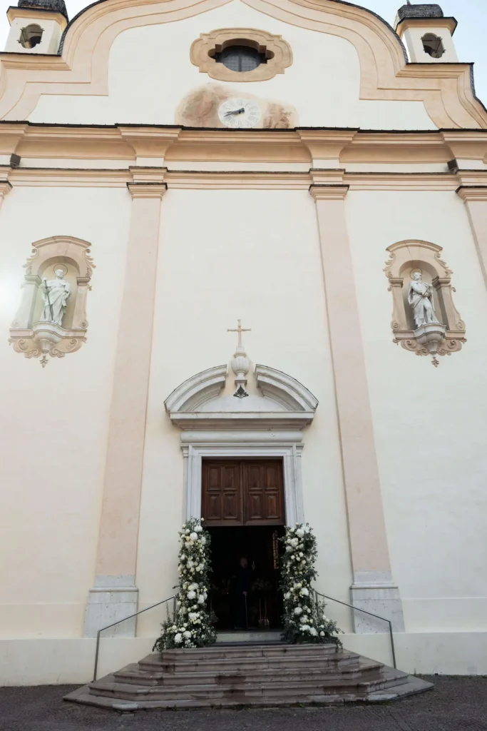 Basilica of Saints Philip and James in Cortina decorated with white flowers
