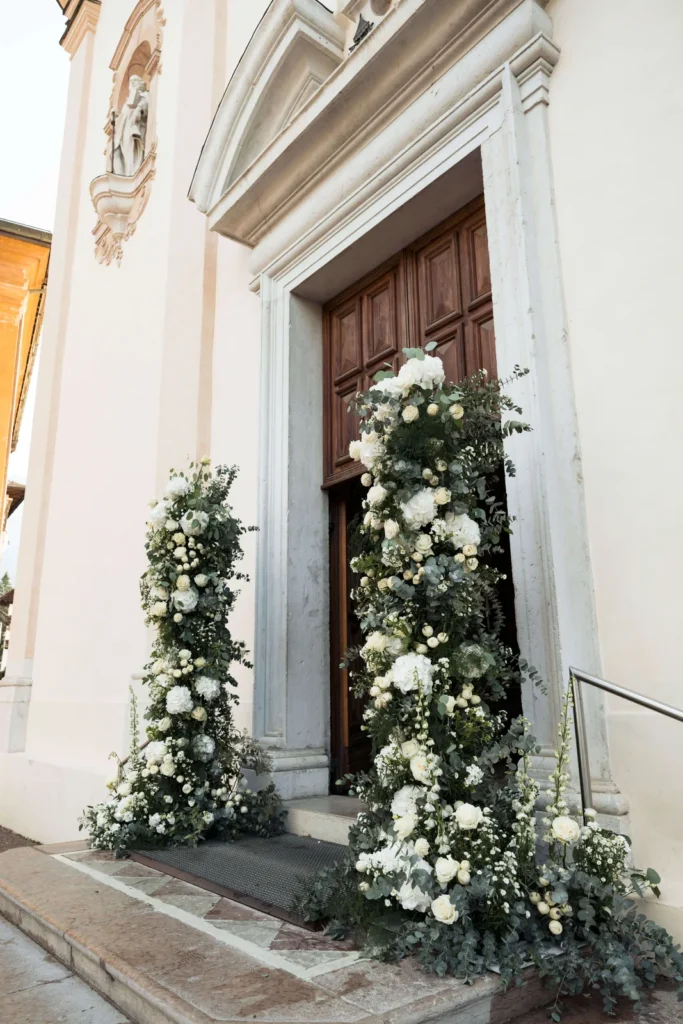 White flower columns at the door of the Cortina basilica