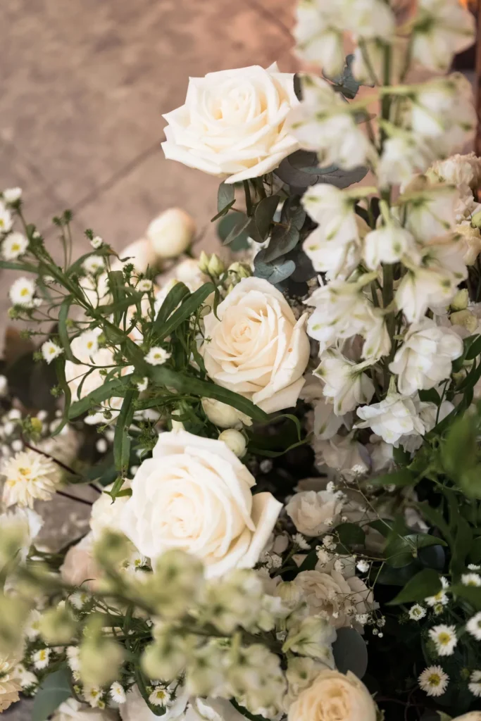 White roses and delphiniums, wedding flower detail