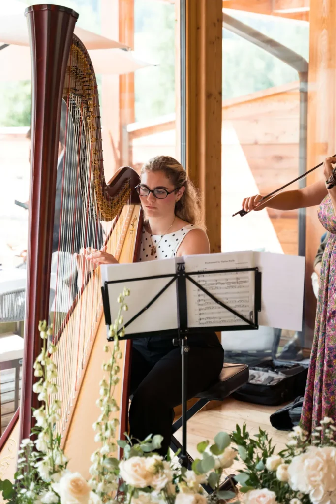 Harp and violin playing at the wedding reception