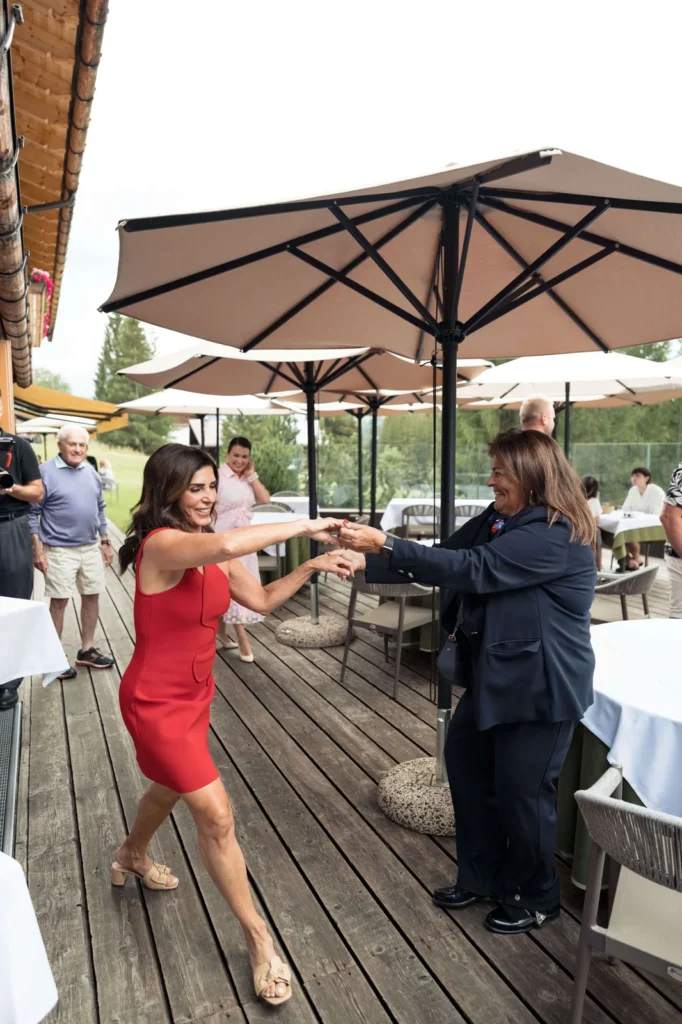 Guests dancing on the lodge terrace