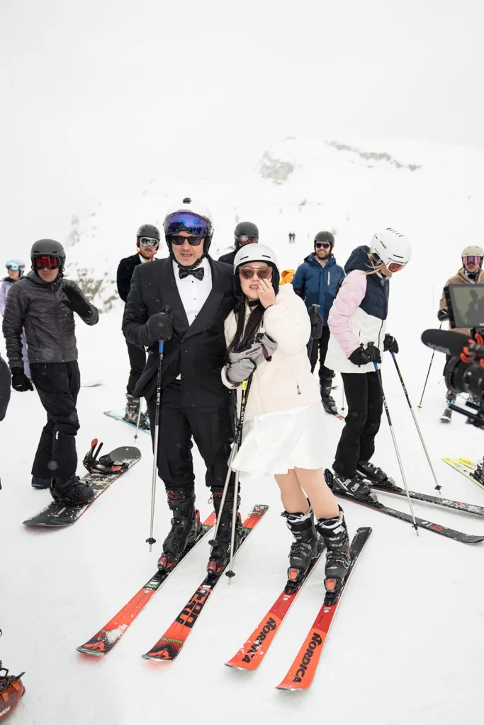 Wedding guests skiing in tuxedos and dresses in Cortina